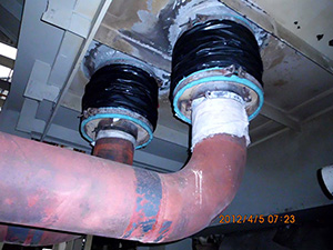 Wall pipe expansion joint